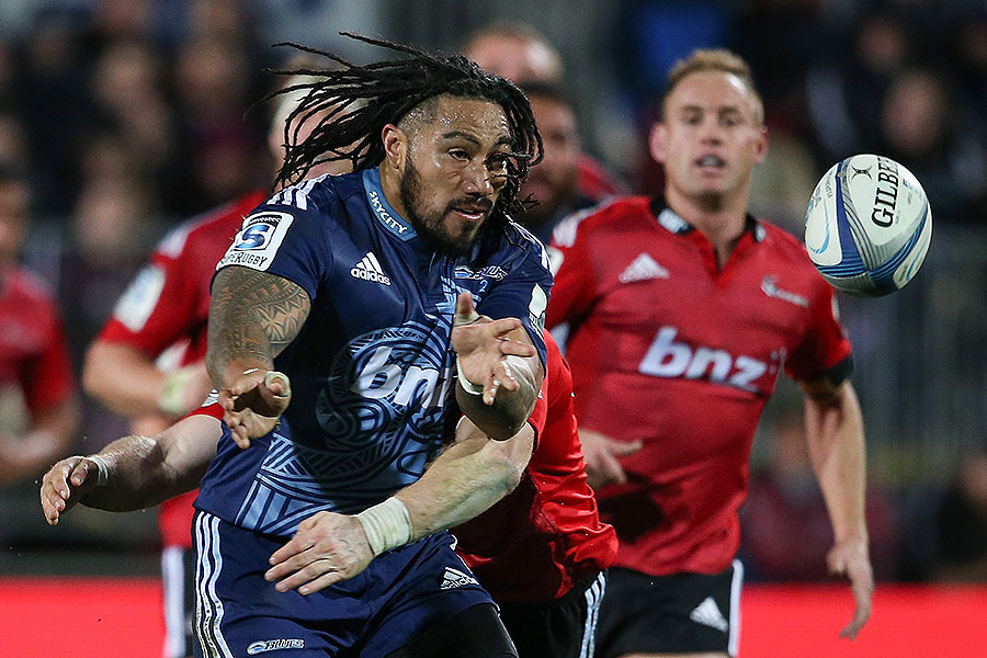 The Blues' Ma'a Nonu passes the ball in a tackle