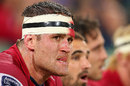 Queensland Reds' James Horwill watches from the bench