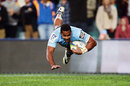 New South Wales Waratahs' Taqele Naiyaravoro scores his first Super Rugby try