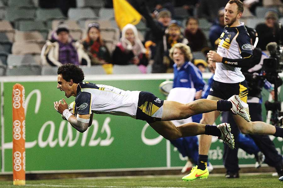 The Brumbies' Matt Toomua dives over for one of his three tries