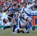 Scotland centre Graeme Morison is wrapped up by the France defence