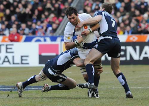 France lock Lionel Nallet is tackled by the Scotland defence
