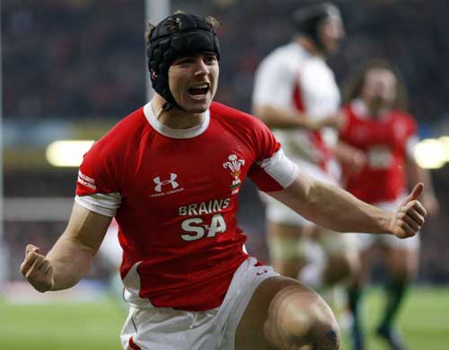 Wales' Leigh Halfpenny celebrates scoring a try against England
