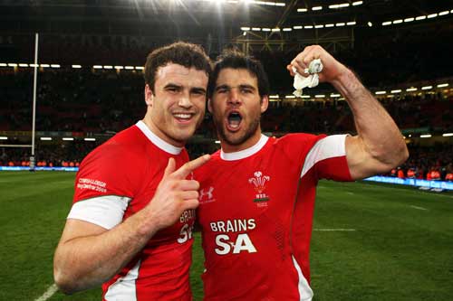 Wales' Jamie Roberts (L) and Mike Phillips celebrate victory over Wales