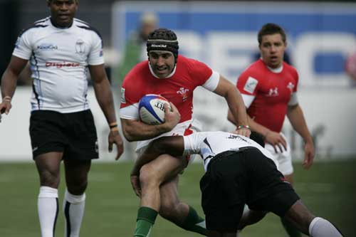 James Merriman of Wales Sevens takes on the Fiji defence