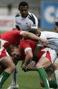 Lee Beach of Wales Sevens tries to break the Fiji defence