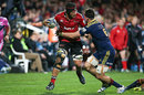 The Crusaders' Jordan Taufua looks to pass in the tackle of Elliot Dixon