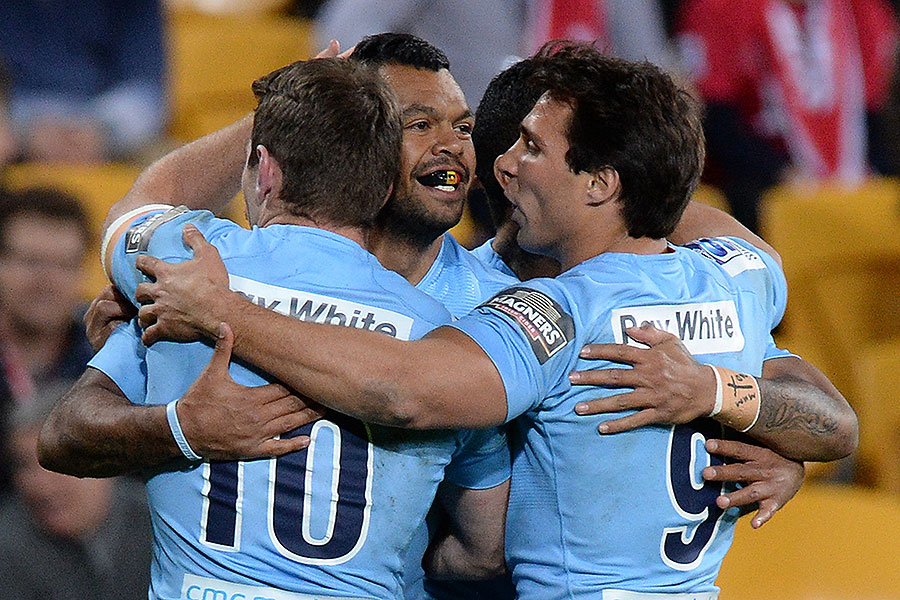 New South Wales Waratahs' Kurtley Beale celebrates a try with Bernard Foley and Nick Phipps