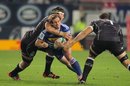 Nic Groom of the Stormers is wrapped up in a tackle