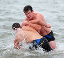 Ian Whitten and Tom Hendrickson frolic in the water during an Exeter training session