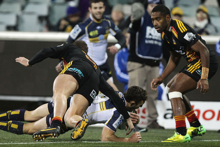 Brumbies scrum-half Nic White dives over for a try