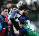 The Waratahs' Jacques Potgieter takes a tackle in training