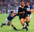 Jonah Lomu rampages through the Samoan defence