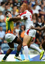 England's James Rodwell holds off Sri Lankan tackles