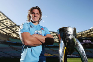 The Waratahs' Michael Hooper poses with the Super Rugby trophy, ANZ Stadium, Sydney, August 1, 2014