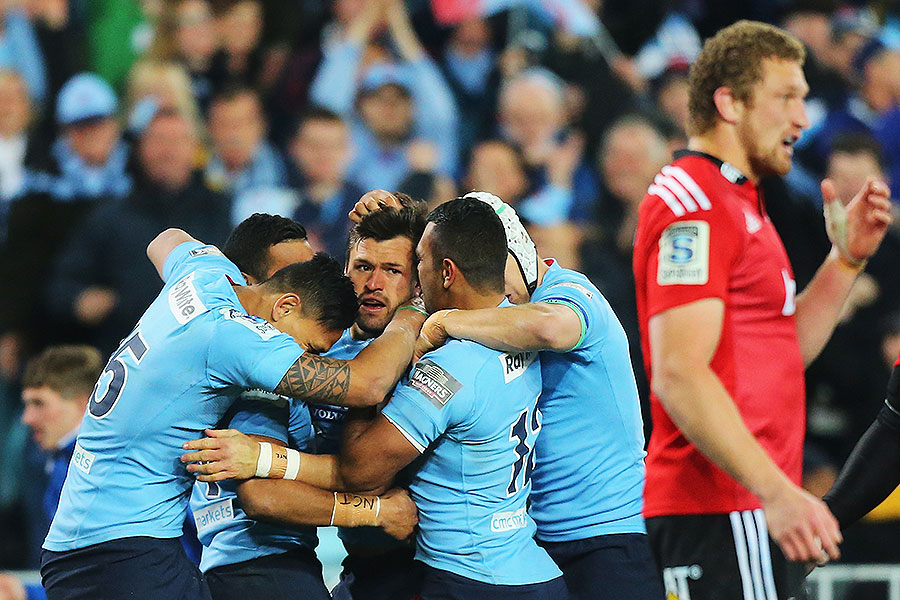 The Waratahs' Adam Ashley-Cooper celebrates with team-mates after scoring a try