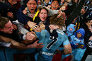The Waratahs' Michael Hooper celebrates victory with fans