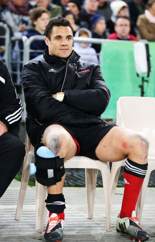 The Crusaders' Dan Carter sits on the bench after leaving the field injured, Waratahs v Crusaders, Super Rugby grand final, ANZ Stadium, Sydney, August 2, 2014