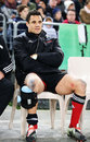 The Crusaders' Dan Carter  sits on the bench after leaving the field injured