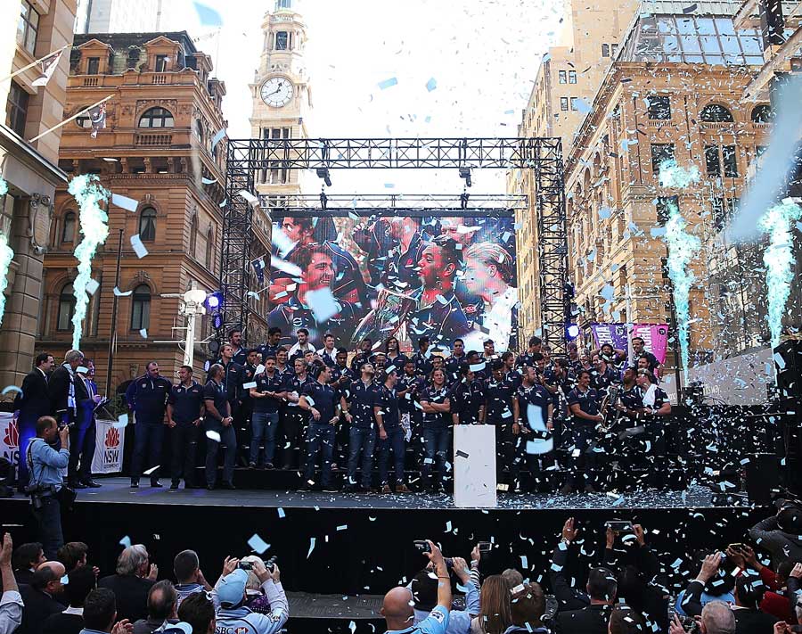 The Waratahs celebrate their Super Rugby grand final win with fans at a presentation in Sydney
