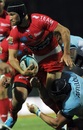 Toulon's Matthew Giteau is tackled by Bayonne's captain Mark Chisholm