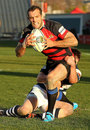 Canterbury's Adam Whitelock breaks tackles to score a try