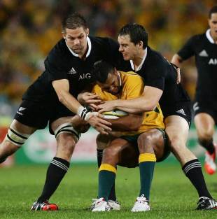 Australia's Kurtley Beale is wrapped up by the New Zealand defence, Australia v New Zealand, The Rugby Championship, ANZ Stadium, Sydney, August 16, 2014