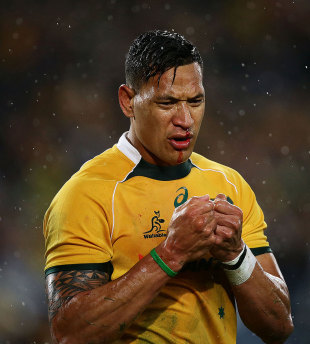 Australia's Israel Folau attends a face injury after a collision with Nic White, Australia v New Zealand, The Rugby Championship, ANZ Stadium, Sydney, August 16, 2014
