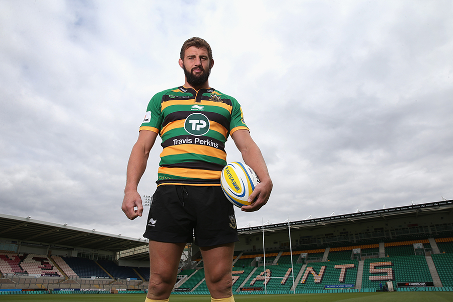 Tom Wood poses in Northampton's latest home kit