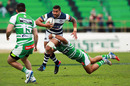 Charles Pitau of Auckland attempts to beat the tackle of Willie Paia'aua of Manawatu