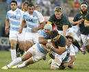 South Africa's Francois Hougaard is taken down by Argentina's defence
