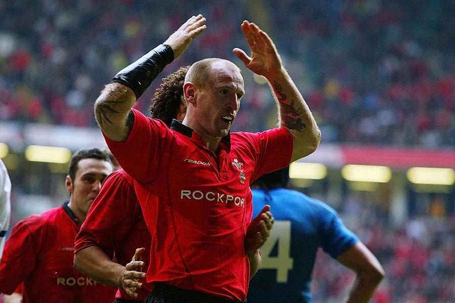 Wales' Gareth Thomas celebrates after breaking Ieuan Evans' Wales try-scoring record