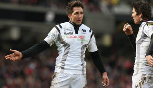 Gavin Henson of the Ospreys speaks with teammate, James Hook (R) during the Heineken Cup Quarter Final match between Saracens and the Ospreys at Vicarage Road on April 6, 2008 in Watford, England