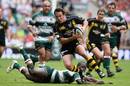 Fraser Waters of Wasps skips through a tackle
