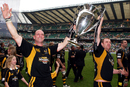 Lawrence Dallaglio celebrates with the Premiership trophy