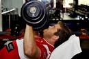 The Reds' Greg Holmes lifts weights during a training session