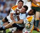 The Waratahs' Rob Horne loses the ball under pressure from the Chiefs' defence