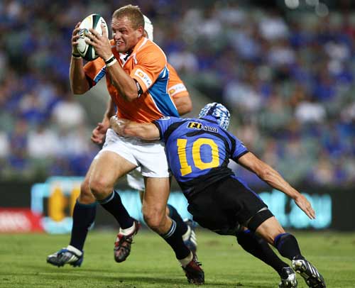 The Cheetahs' Meyer Bosman is tackled by the Western Force's Matt Giteau