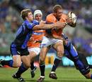The Cheetahs' Meyer Bosman is tackled by the Western Force's David Pocock and Matt Giteau