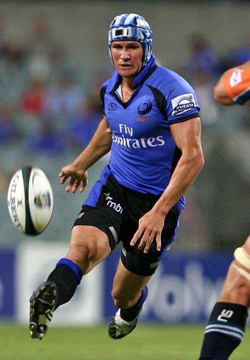 The Western Force's Giteau launches a kick and chase