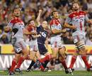 Crusaders players watch a conversion by the Brumbies' Stirling Mortlock