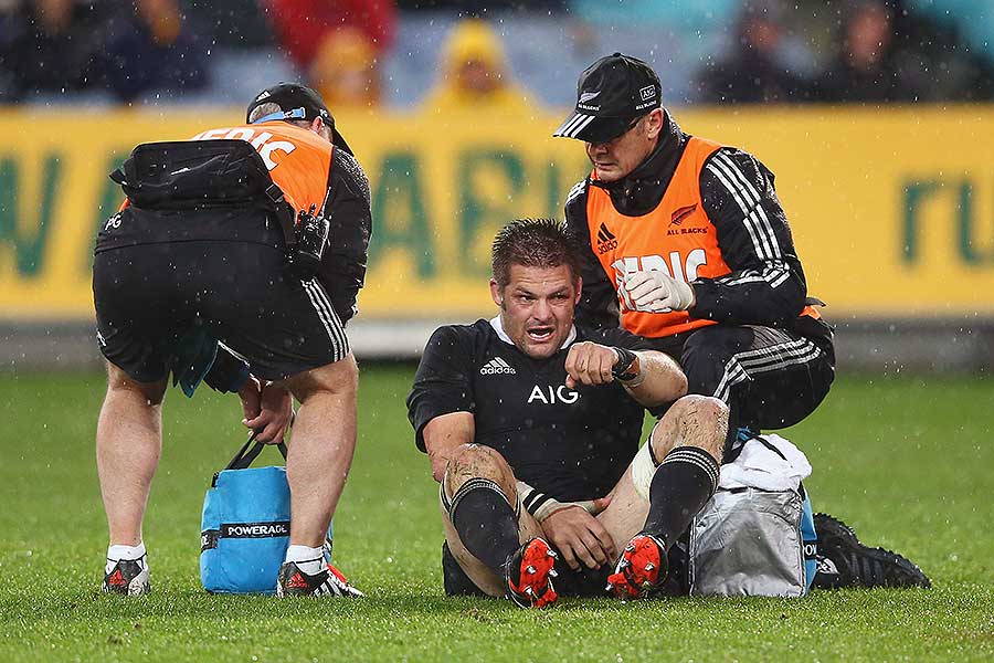 New Zealand's Richard McCaw receives attention from the trainers