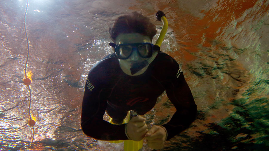 Beauden Barrett of the All Blacks swims among the marine life 