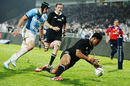 All Blacks' wing Julian Savea dives on the ball to score a try