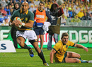 Springboks' winger Cornal Hendricks brushes past a Wallabies defender to score a try