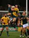 Wallabies Nick Phipps and Springboks Jan Serfontein compete in the air for a highball