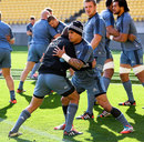 Aaron Cruden and Aaron Smith warm up during a New Zealand training session