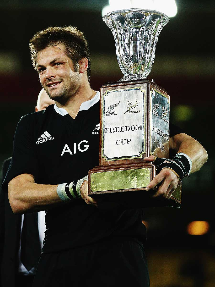 New Zealand's Richie McCaw shows off the Freedom Cup