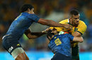 Australia's winger Peter Betham takes on the Pumas defence