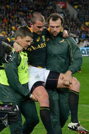 South Africa's Ruan Pienaar is carried from the pitch, New Zealand v South Africa, Rugby Championship, Westpac Stadium, Wellington, September 13, 2014